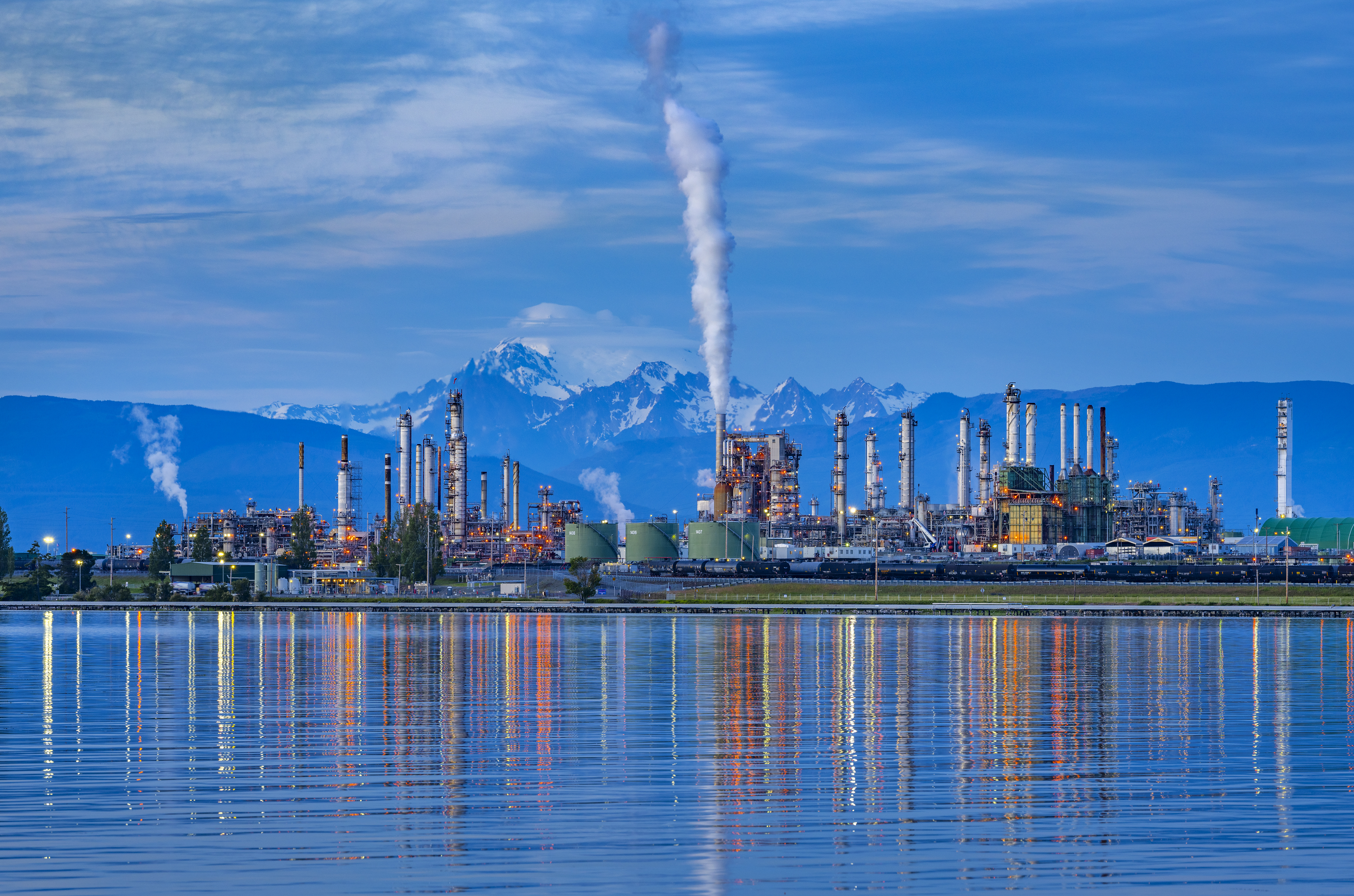 Anacaortes Refinery in Washington State from across the water with a mountain in the background